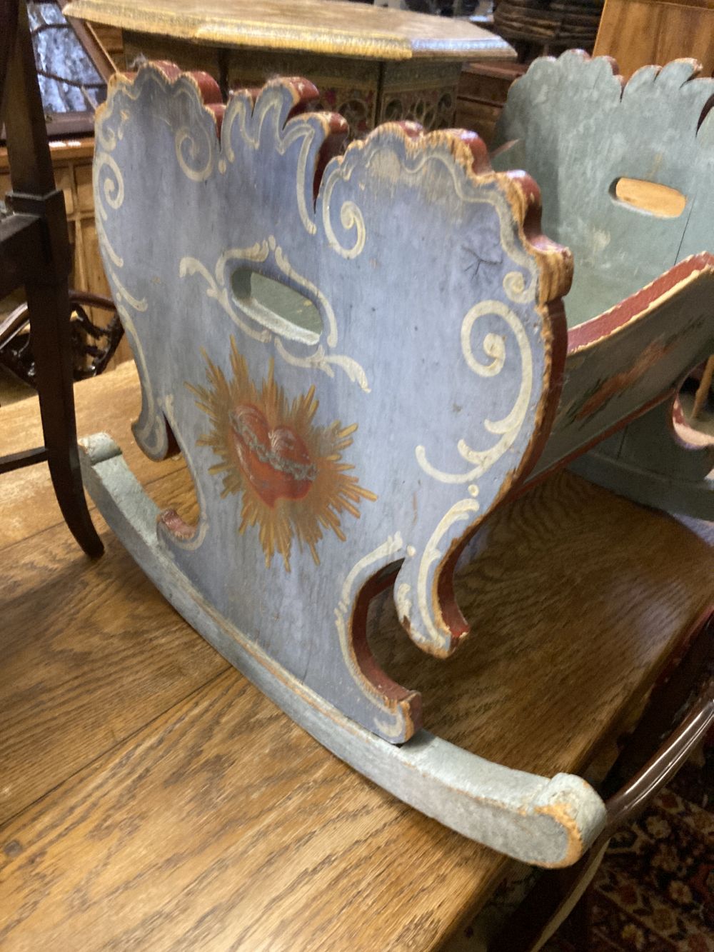 A 19th century Continental painted pine rocking cradle, 62 x 46cm height 54cm